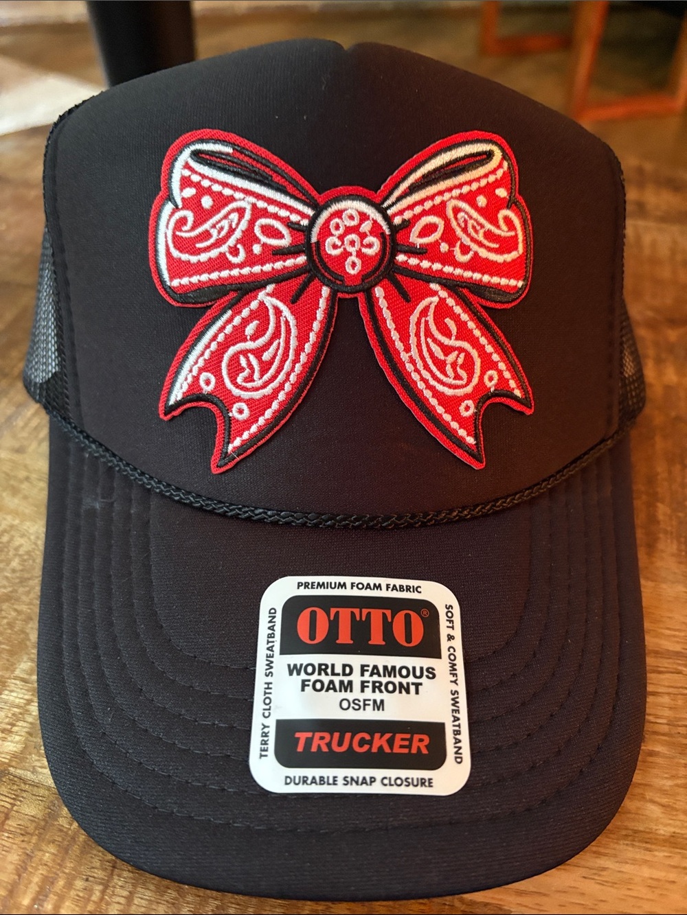 OTTO Black Trucker Hat with Red Bow Patch
